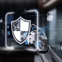 robot hand pointing to screen showing shield with padlocks