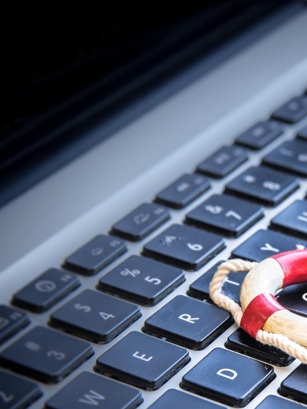 Small life ring thrown across a laptop keyboard