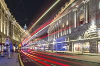 Image showing blur of bus light through the street
