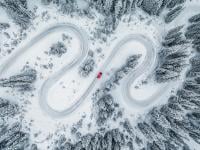 Image showing a car navigating through a snowy path