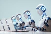 Humanoid robots working at laptops
