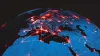 An image of a globe with connecting red beams of light