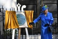 Her Majesty The Queen unveils a plaque outside Watergate House, London, to mark GCHQ's centenary.