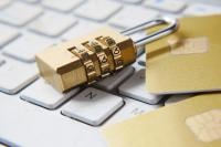 A padlock sits on a computer keyboard