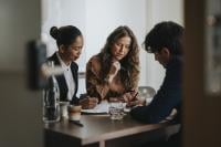 People at a meeting round the table